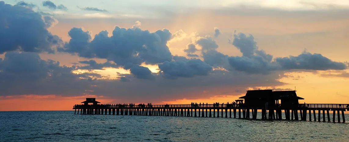 The Naples Pier at sunset on the Gulf of Mexico.